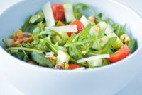 Vibrant Arugula Salad with Sweet Pear Crisp Apple and Pistachio Crunch
