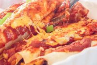 Spicy Beef Enchiladas Smothered in Gooey Cheese