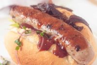 Grilled Beer Brats Crowned with Sweet Caramelized Onions