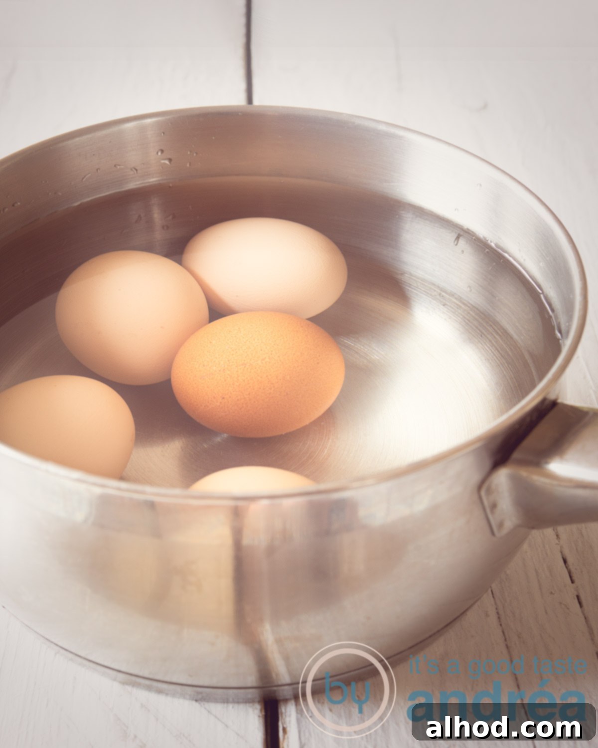 Mastering Hard and Soft Boiled Eggs 2 How to cook the perfect hard-boiled egg, showing eggs in a pan with cold water