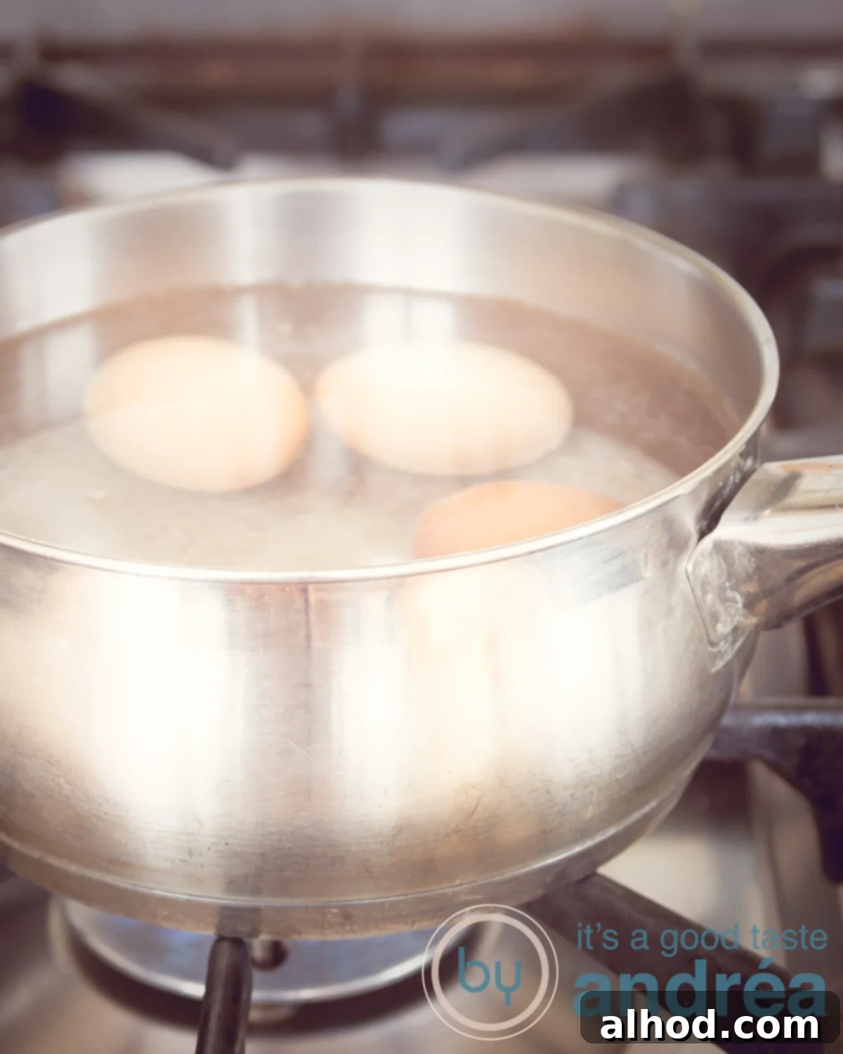 Perfect Eggs From Runny to Firm 3 Water beginning to boil around eggs in a saucepan on the stove.