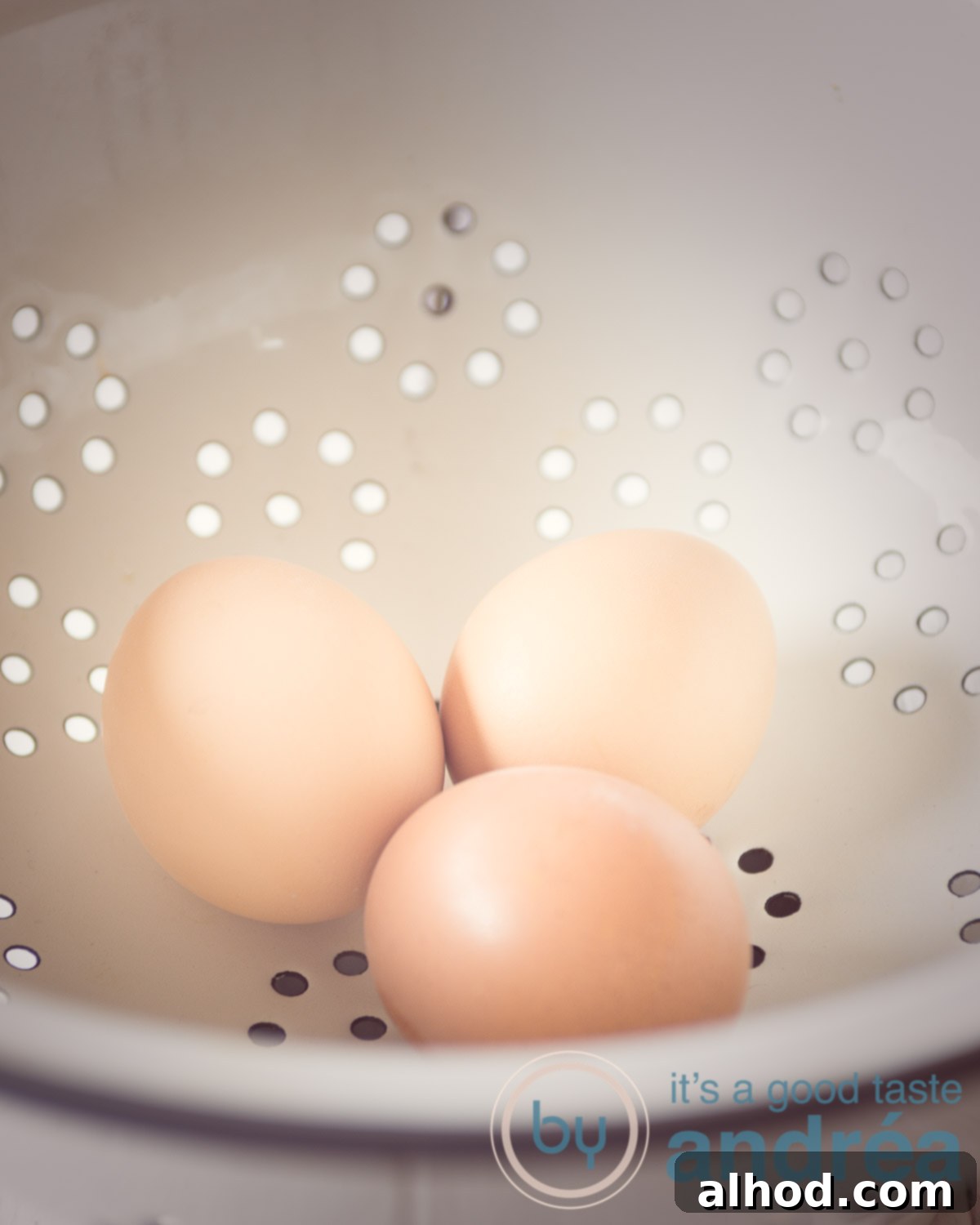 Mastering Hard and Soft Boiled Eggs 5 How to cook the perfect hard-boiled egg, showing eggs being rinsed under cold water
