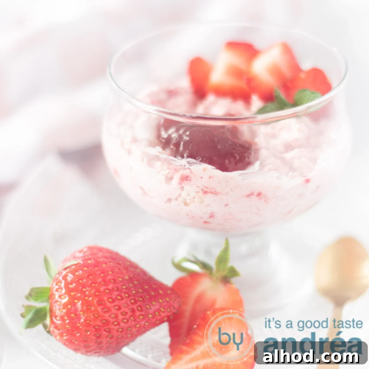Creamy Strawberry Oat Smoothie Bowl 6 Square photo of strawberry mousse with oatmeal in a glass with a topping of fresh strawberries (these are also in front).