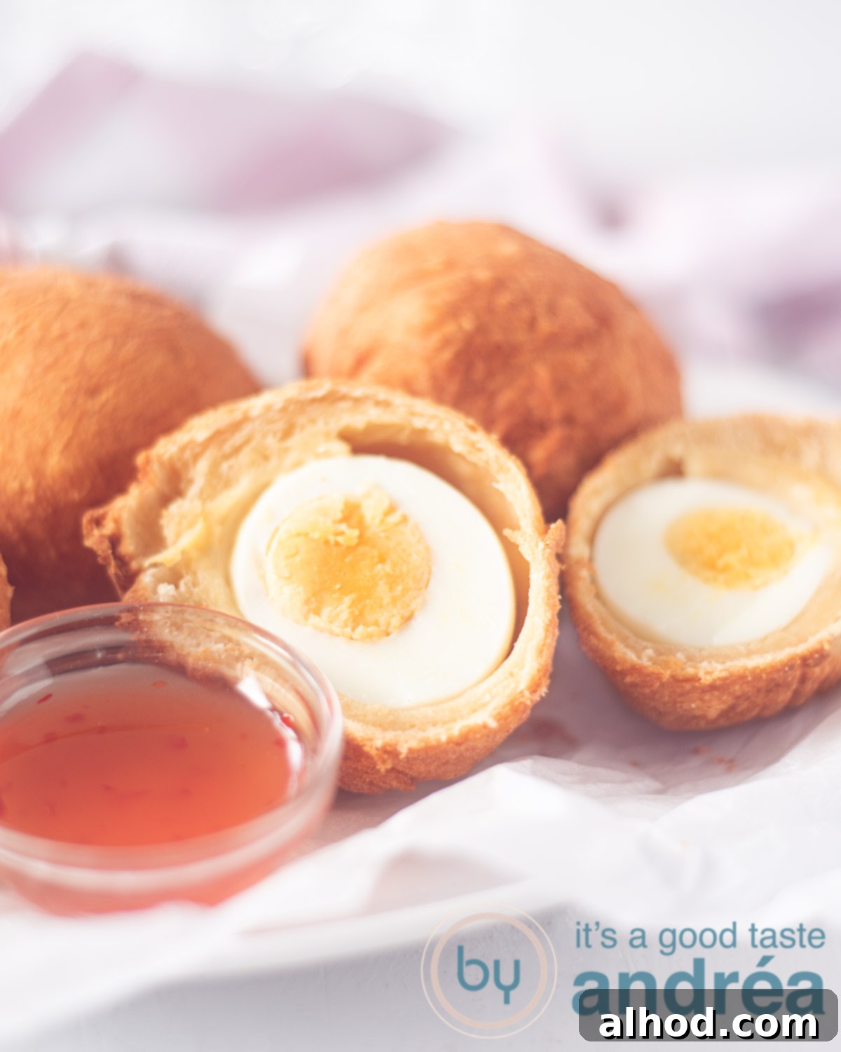 Afrorolls 4 African Egg balls on a plate with sweet chili sauce