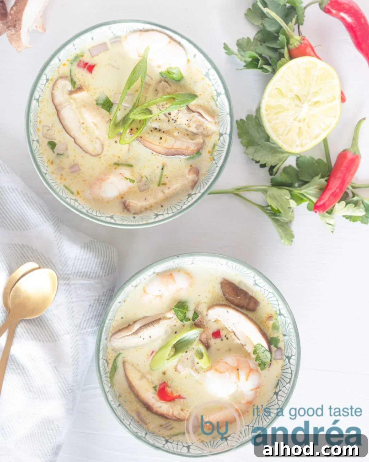 Tom Kha Goong Thai Coconut Shrimp Soup 2 Photo from above with two bowls filled with soup. Shiitake shrimp. A garnish of parsley, lime and pepper