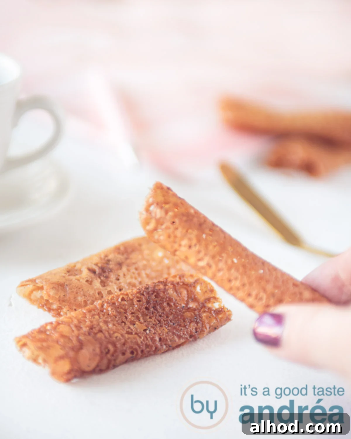 Easy Honey Lace Tuiles Recipe 8 Honey tuiles on a wire rack, dusted with cinnamon