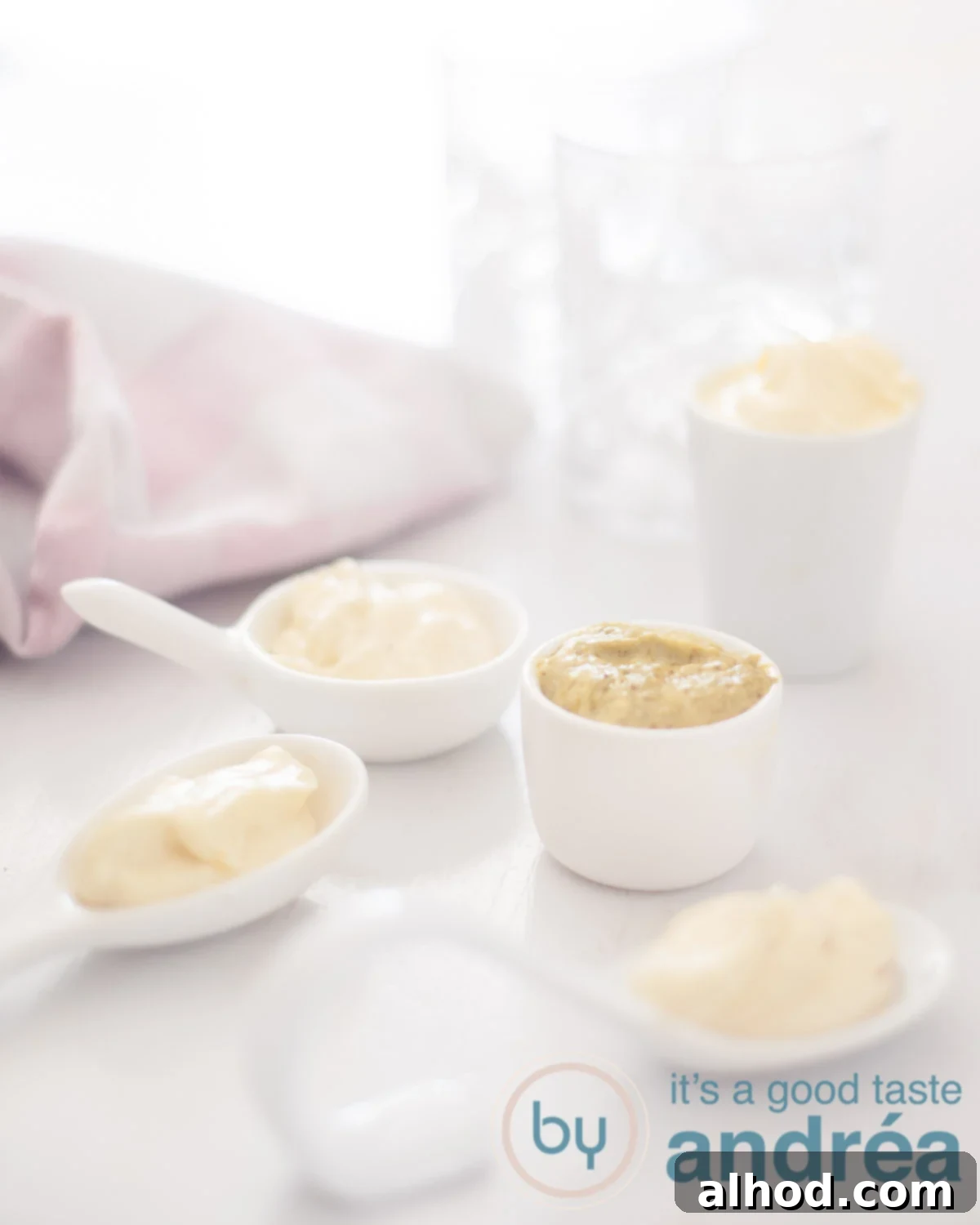 Spice Up Your Mayo 5 Creative Recipes 13 5 bowls filled with different mayonnaise varieties on a white background