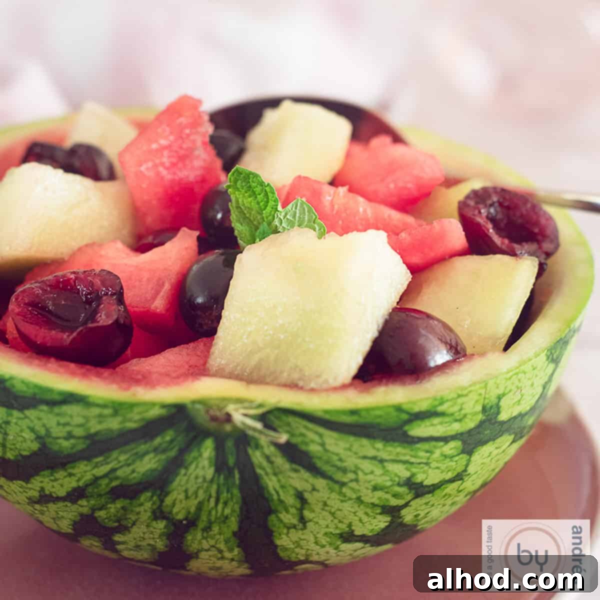 Watermelon Oasis Fruit Basket 4 A square picture of a watermelon halfed and filled with fruit