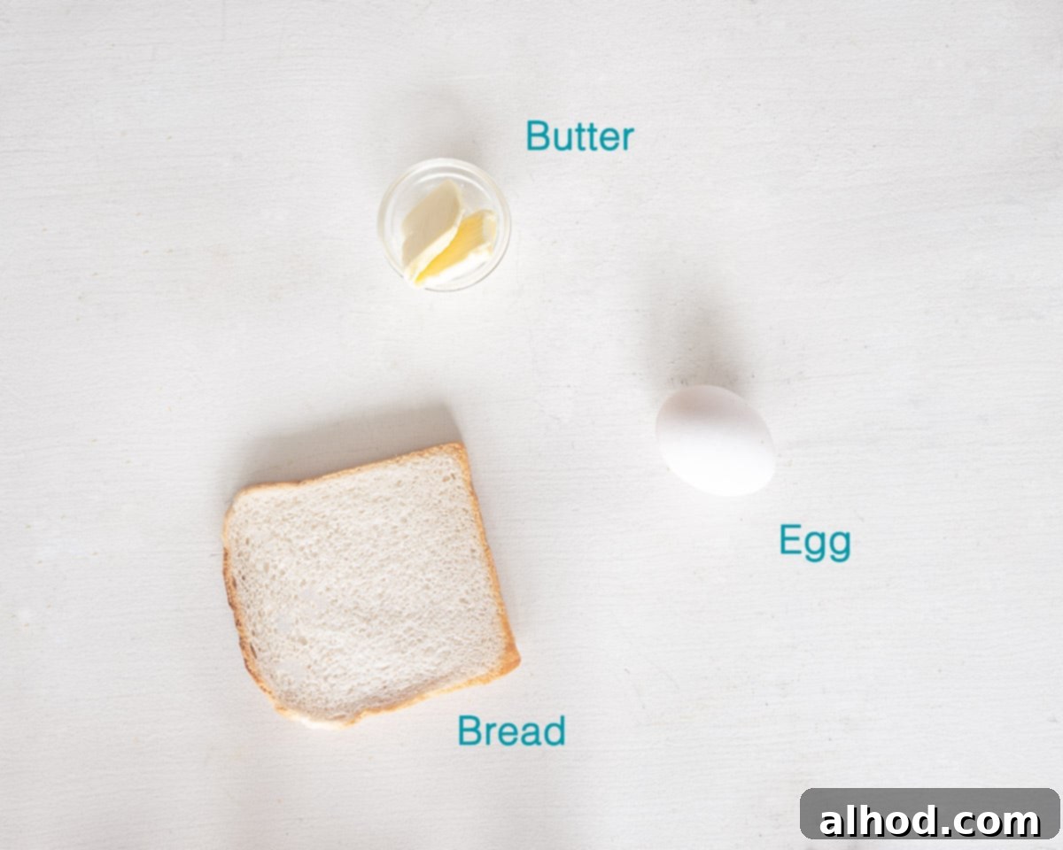 Love Heart Egg Toast 3 Making Valentine's Breakfast Ingredients- Egg in Bread. A simple layout of bread, butter, and an egg for a heart-shaped egg in a hole.
