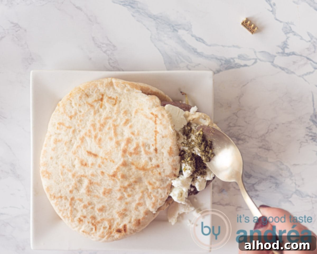 Mediterranean Feta Burgers Made Easy 5 A spoonful of Za'atar spice on crumbled Feta cheese