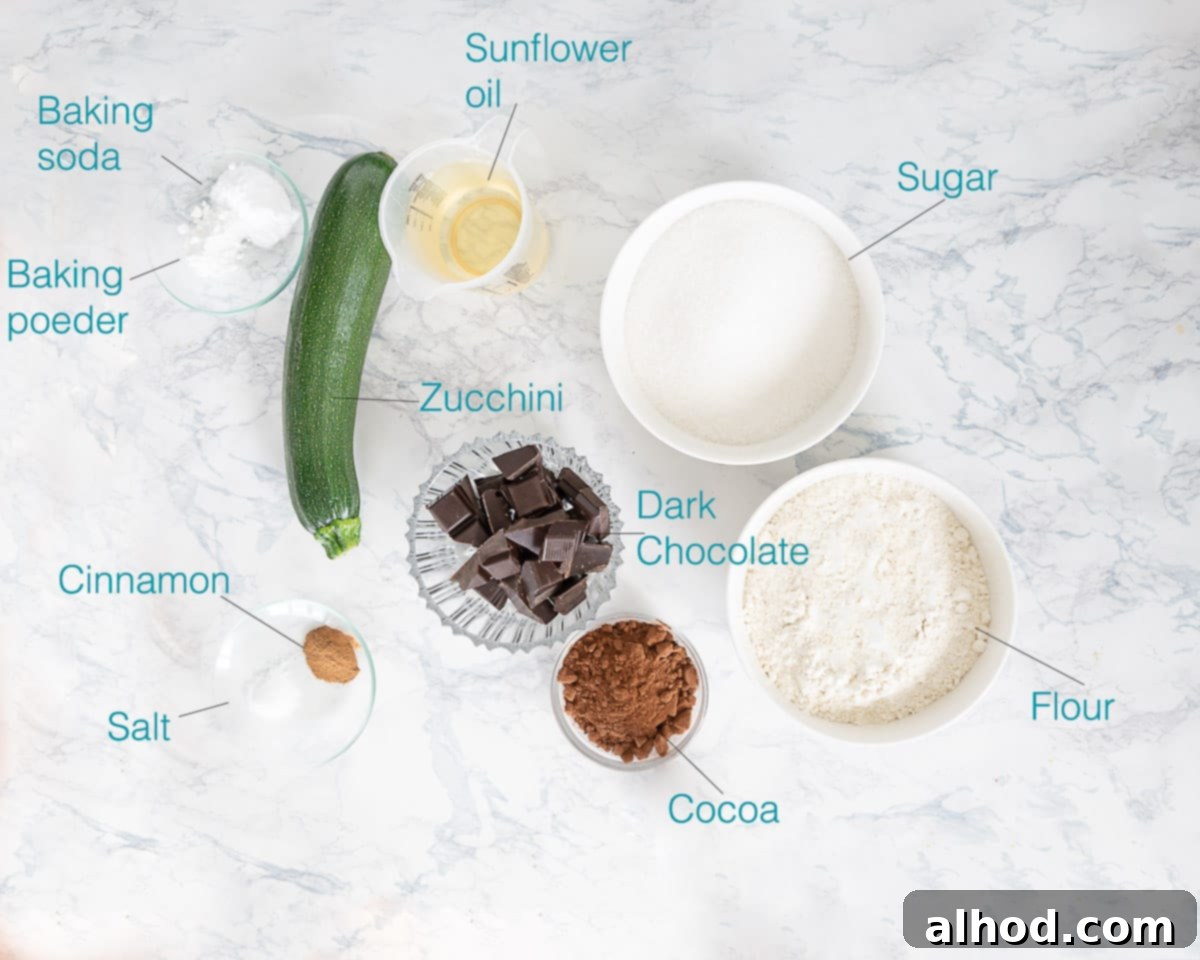 Decadent Dark Chocolate Zucchini Cake 3 Ingredients Chocolate Zucchini Cake, individually labelled on a white marble background