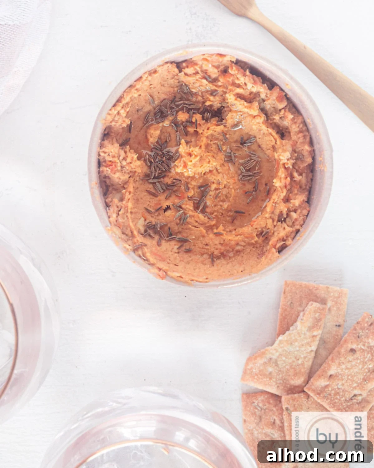 Velvet Sweet Potato Hummus 2 Sweet potato hummus in a pink bowl with some crackers