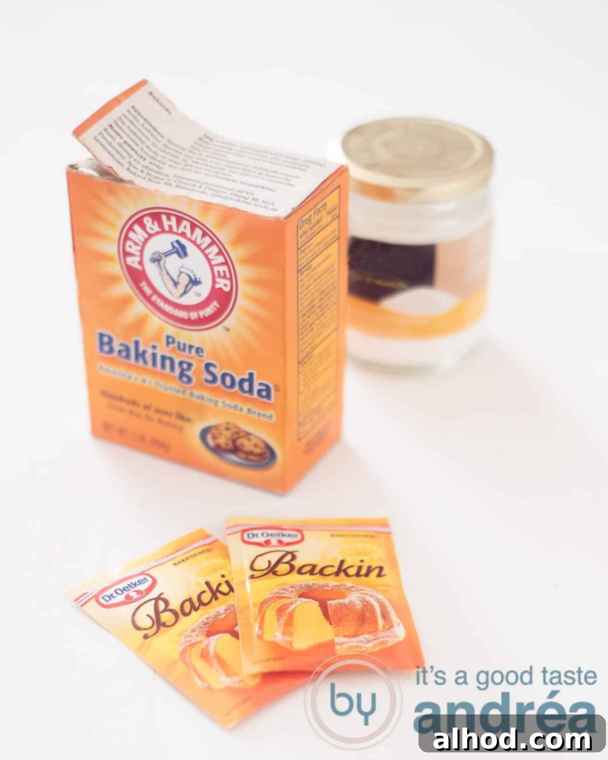 An elevation photo with a white background with bags of baking powder, a pack of baking soda and a jar of tartaric acid