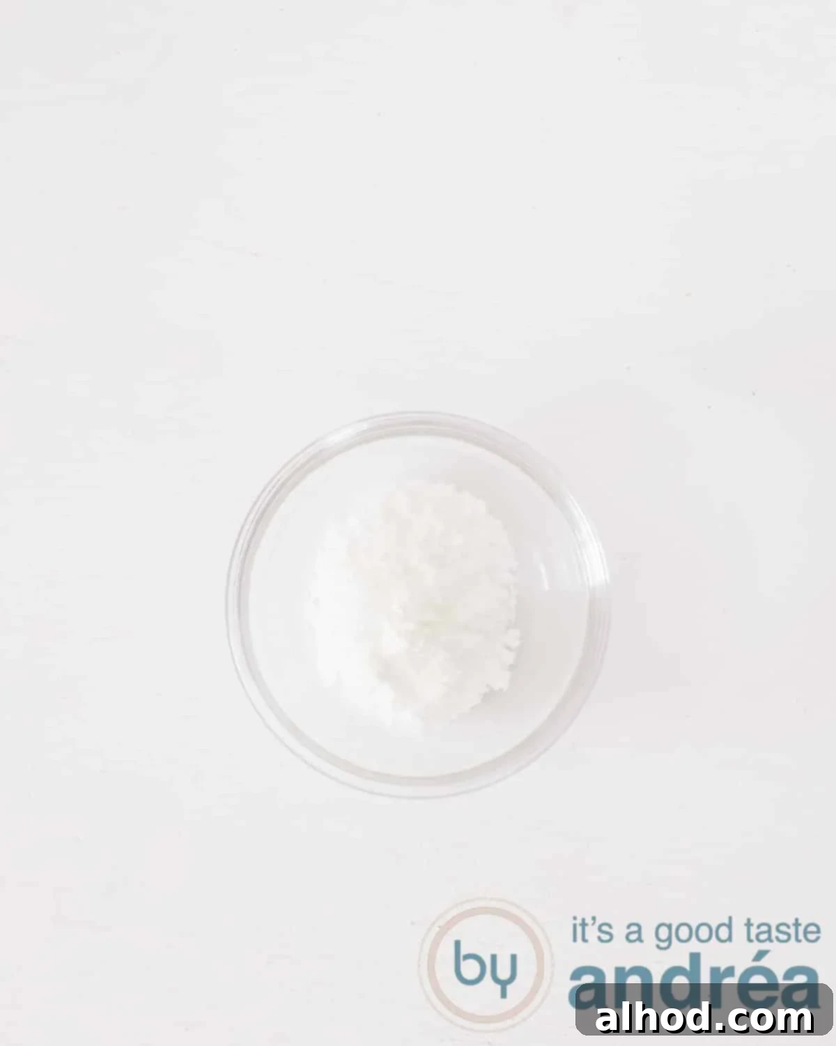 A glass bowl with baking powder