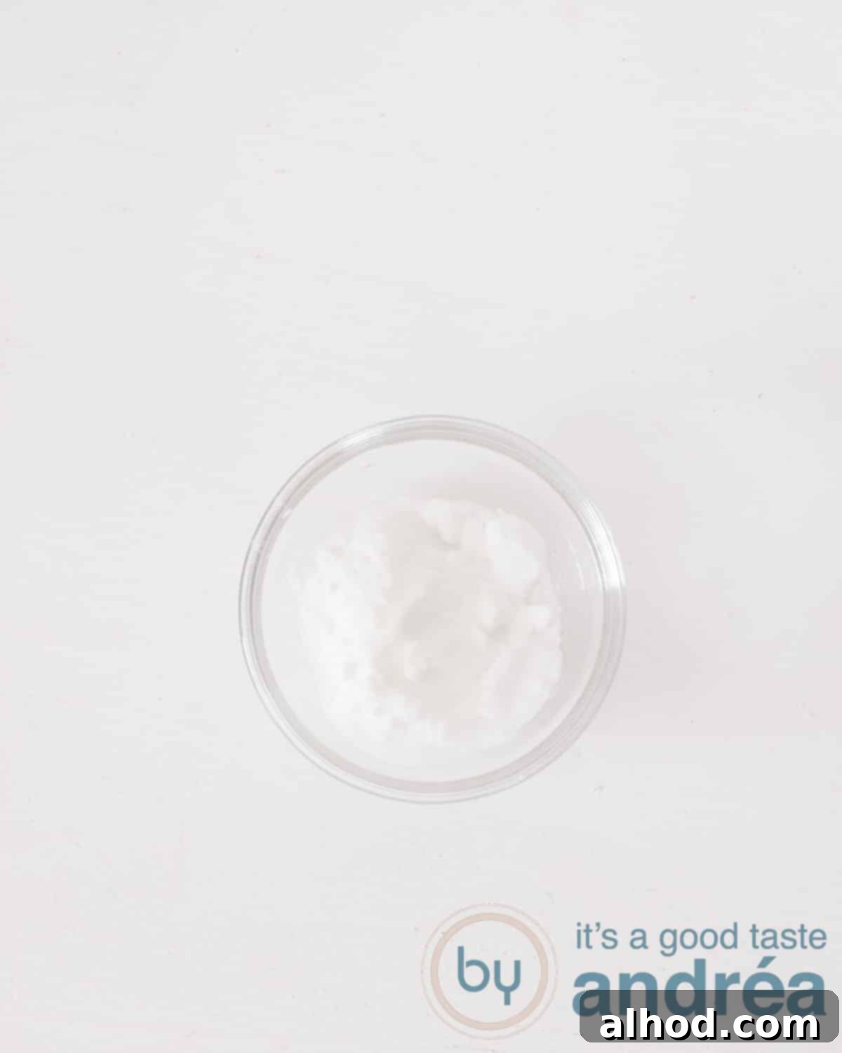 Baking Powder vs. Baking Soda: Decoding the Distinction 4 A glass dish with baking soda on a white background
