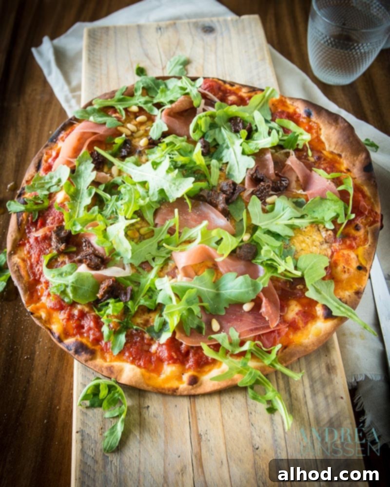 Gourmet Prosciutto, Arugula, and Pine Nut Pizza 3 PIZZA ITALIAN DE LUXE WITH PARMA HAM, ARUGULA AND PINE NUTS