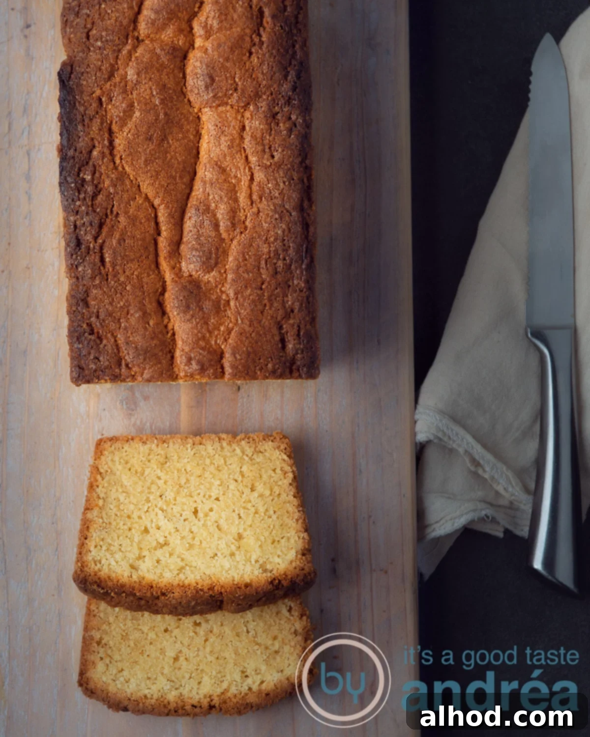 An easy pound cake, perfectly baked and sliced, on a clean background.