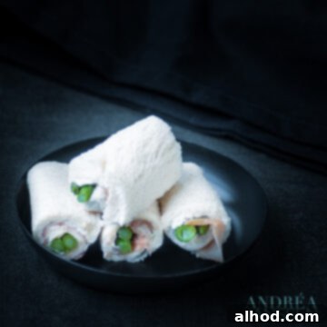 Exquisite High Tea: Four Sandwiches for a Lasting Impression 3 Exquisite asparagus roll-ups with ham and blue cheese, a perfect savory bite for high tea.