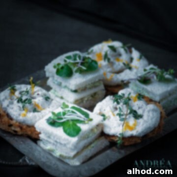 Exquisite High Tea: Four Sandwiches for a Lasting Impression 5 Elegant sandwiches with creamy smoked salmon and watercress mousse, ideal for a refined high tea.