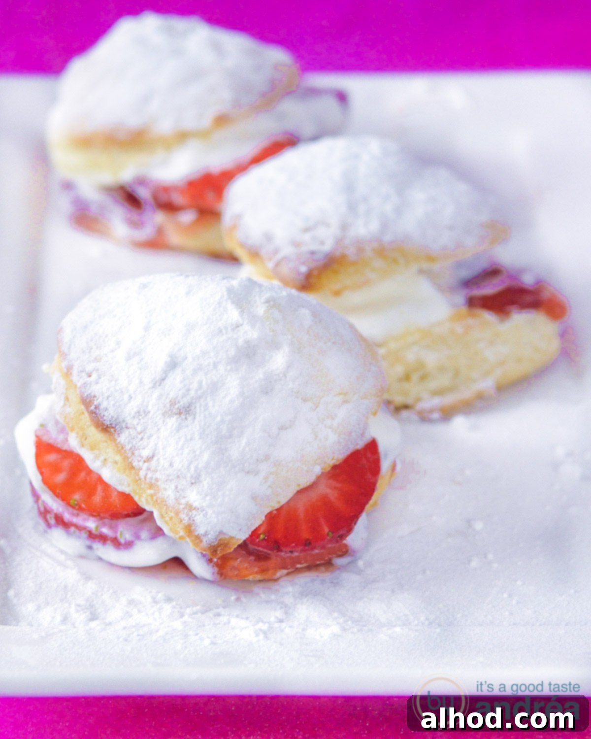Strawberry and Cream Scones 8 3 homemade scones with strawberries on a white plate