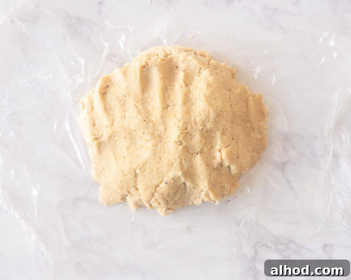 Toasted Hazelnut Mince Pies 6 Pastry dough wrapped in plastic wrap, chilling in preparation for fruit mince pies.