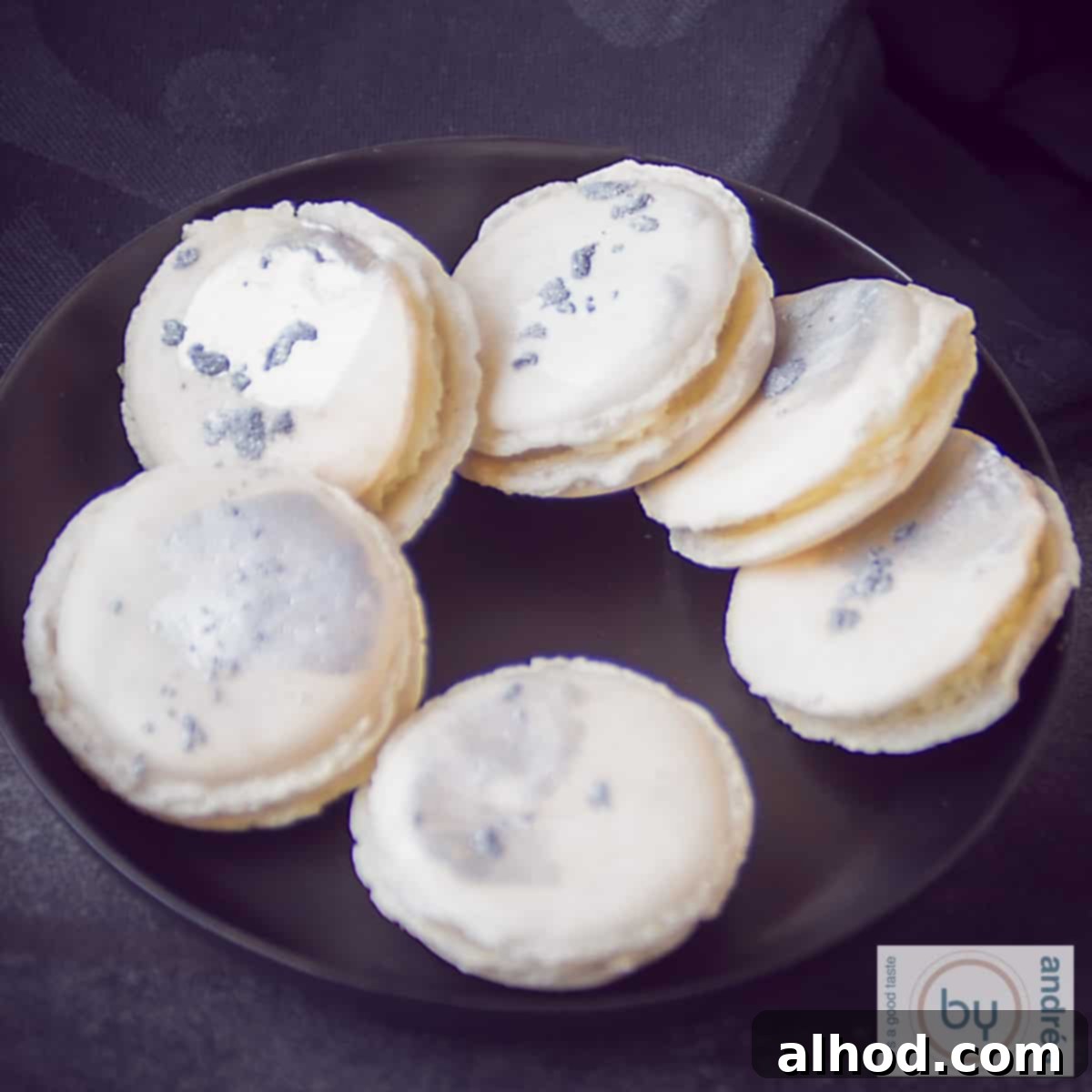 Homemade Macaron Trio: Three Delicious Flavors 5 Macarons with chocolate Baileys filling on a black plate
