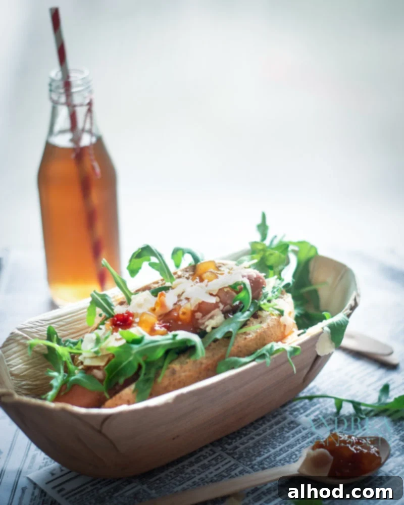 Haute Dog 3 Gourmet Hot Dog the Luxe served in a stylish bamboo holder with a refreshing drink, showcasing a healthy and flavorful meal option.