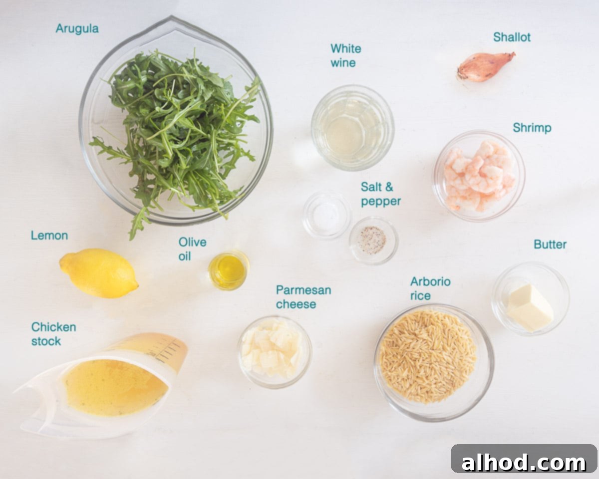 Zesty Lemon and Parmesan Arugula Risotto 3 A flat lay of fresh ingredients for risotto: Arborio rice, chicken stock, white wine, butter, olive oil, prawns, lemon, Parmesan, arugula, and a shallot