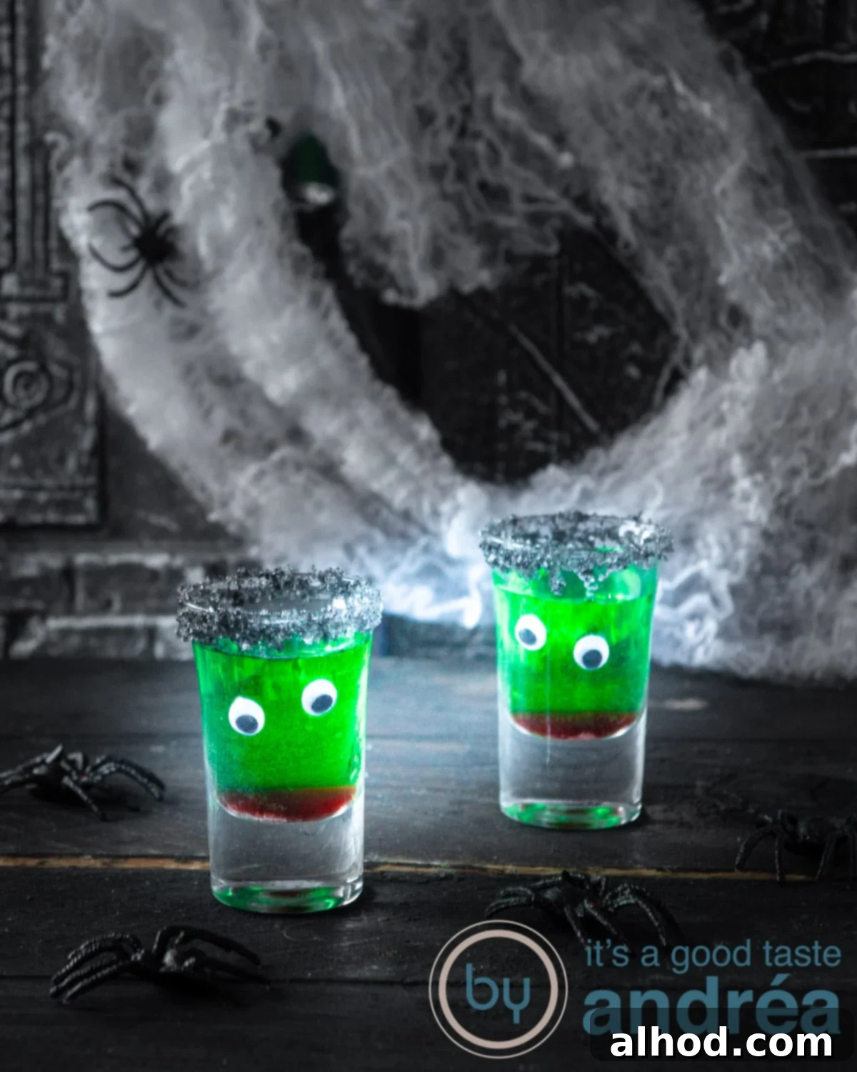 Kid-Friendly Halloween Potions 5 Kids Halloween drink non alcoholic: a close-up of a glass with green juice, red syrup, and edible eyes.