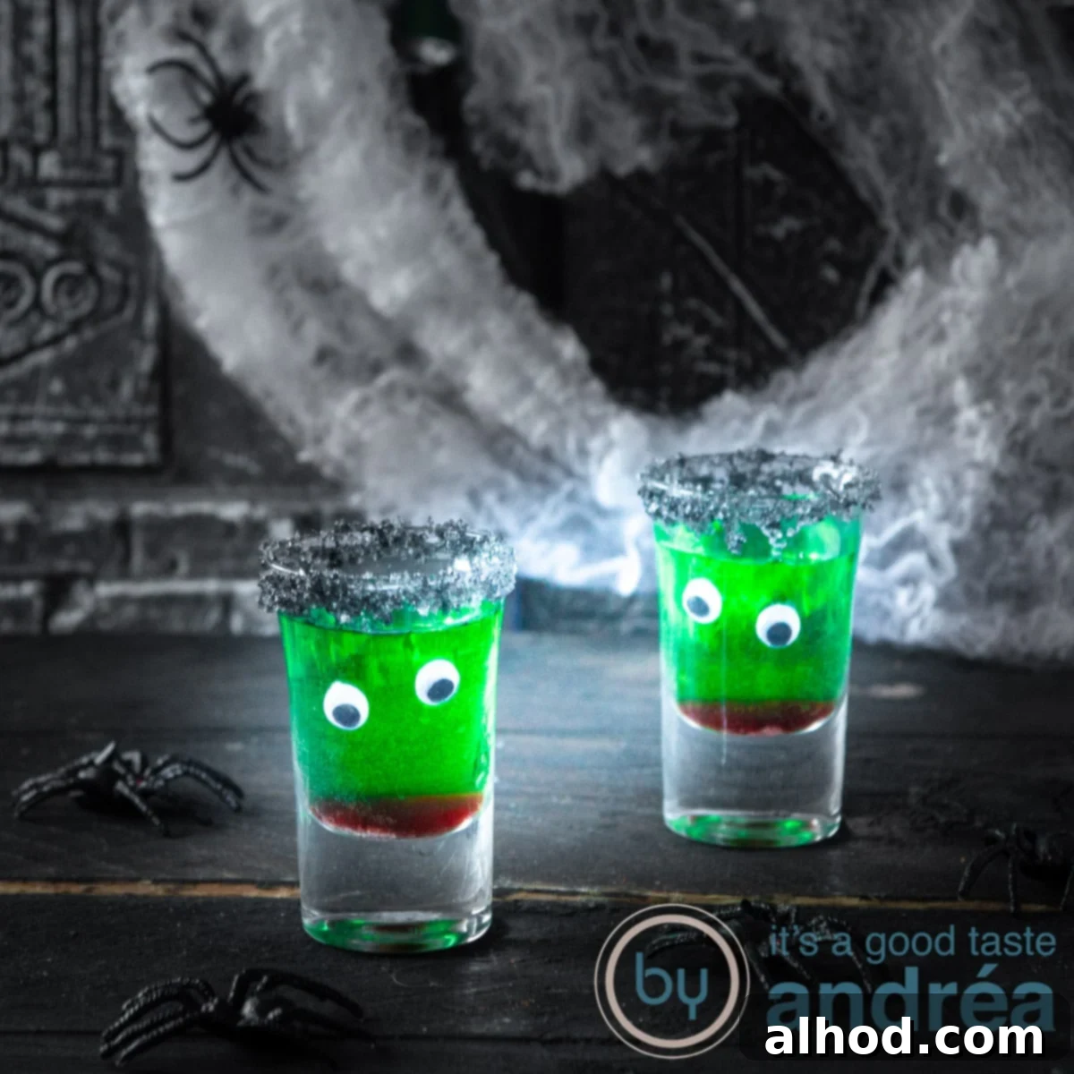 Kid-Friendly Halloween Potions 6 Two glasses filled with non-alcoholic Halloween drinks, adorned with edible eyes and a red mouth design.