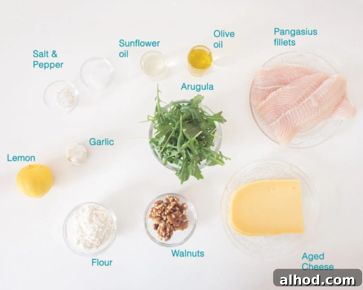 Ingredients for Pangasius Fillet with Pesto and Lemon, arranged on a white background, each item individually labelled for clarity.