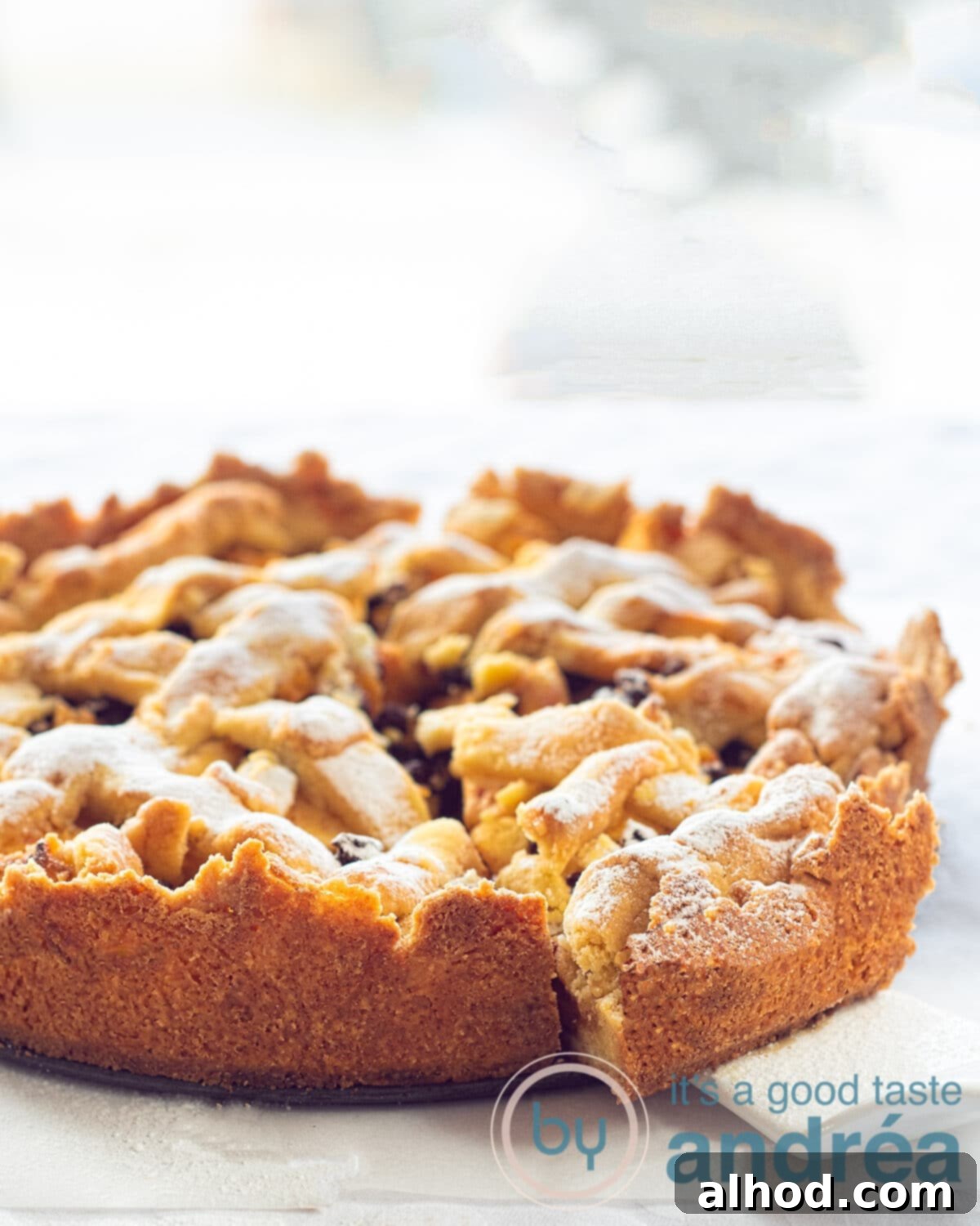 Grandma's Authentic Dutch Apple Pie 9 A freshly baked Dutch apple pie with a slice removed, showing the rich apple and currant filling.