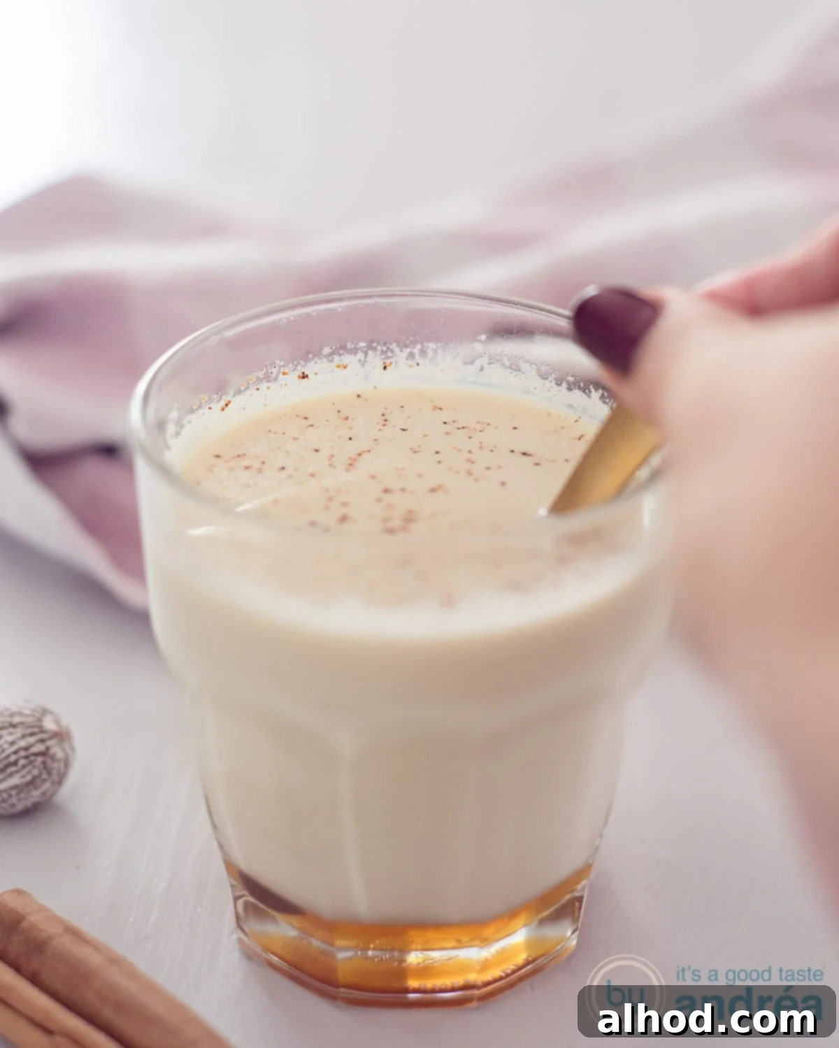 DIY Spiced Chai Perfection 3 Chai tea served in a glass with a handle, garnished with spices around it.