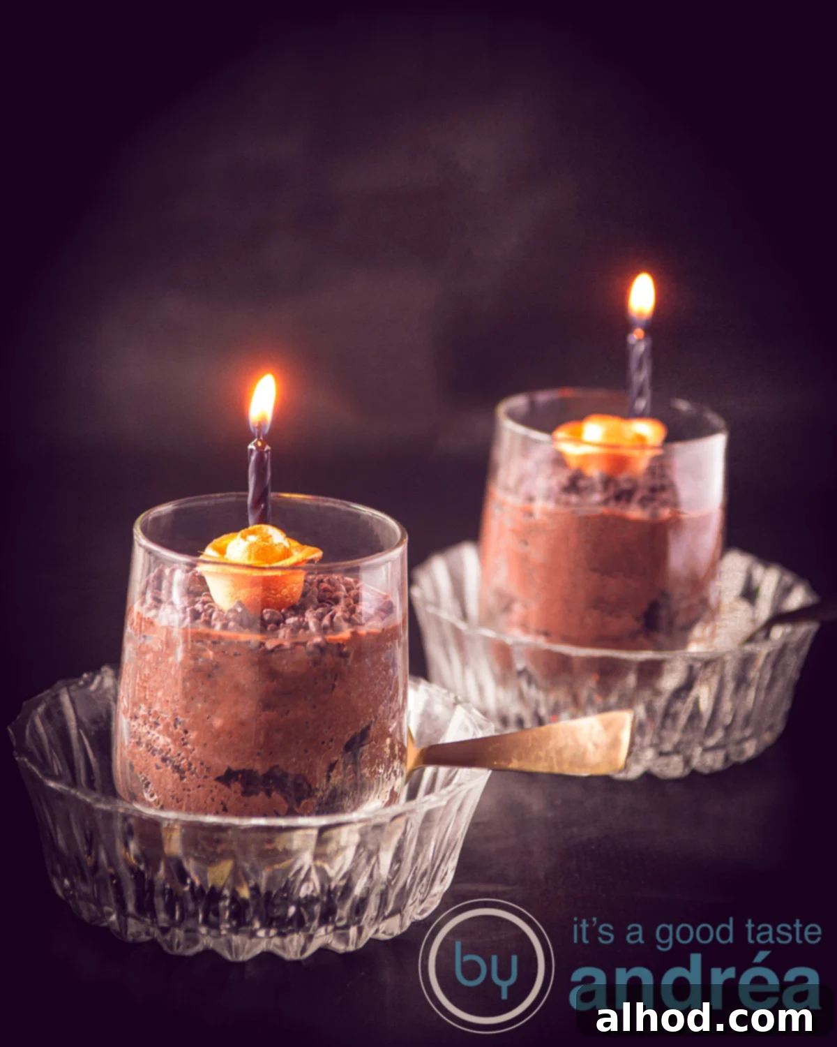 Spooktacular Chocolate Mousse 4 Fluffy chocolate mousse Halloween style in a glass bowl, with golden roses and black candles on a black background