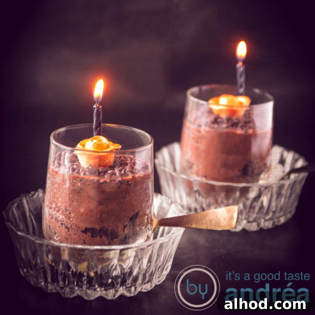 Spooktacular Chocolate Mousse 5 a square photo with two glass bowls and in there two glasses filled with chocolate mousse, a golden rose and a black candle lit.