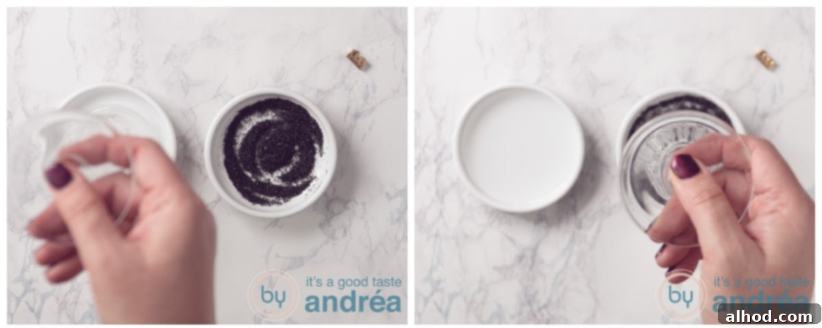 Dipping a cocktail glass rim into fresh lemon juice, then black sugar, for a spooky Halloween cocktail presentation.