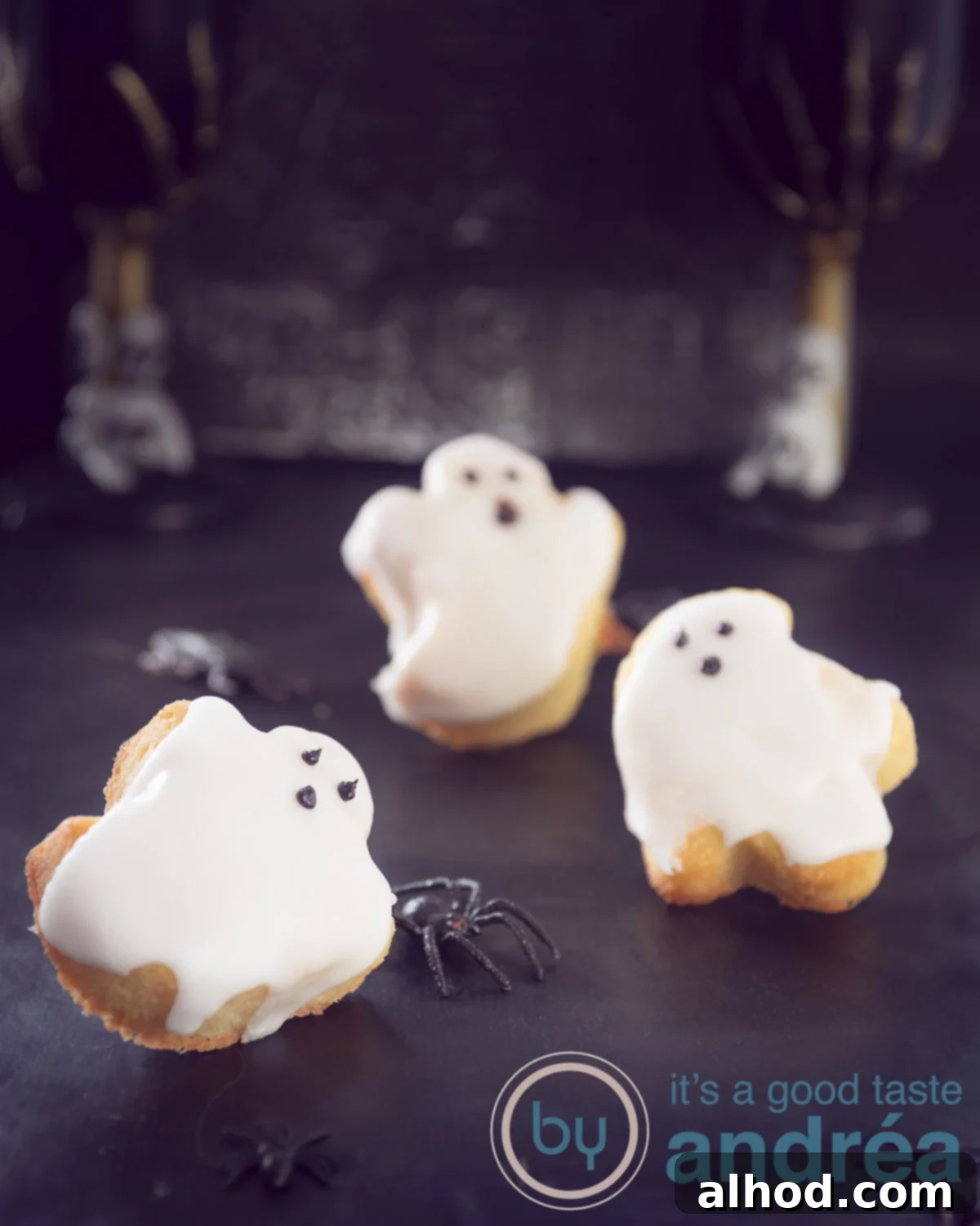 Haunted Cupcakes with Chocolate Ghost Faces 3 Halloween ghost cupcakes cooling on a rack, ready for decorating