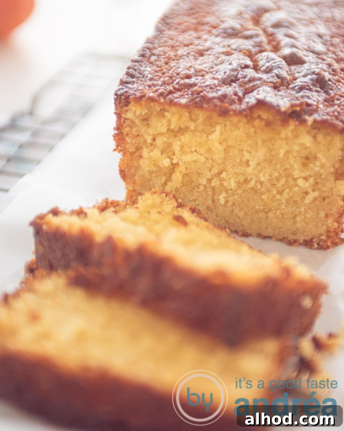 Moist Tangerine Yogurt Pound Cake 2 tangerine cake sliced on a wire rack