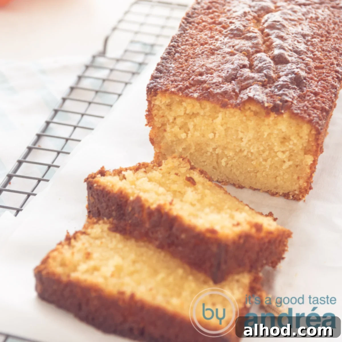 Moist Tangerine Yogurt Pound Cake 9 tangerine cake in a cake tin. Two slices in front and some tangerine parts