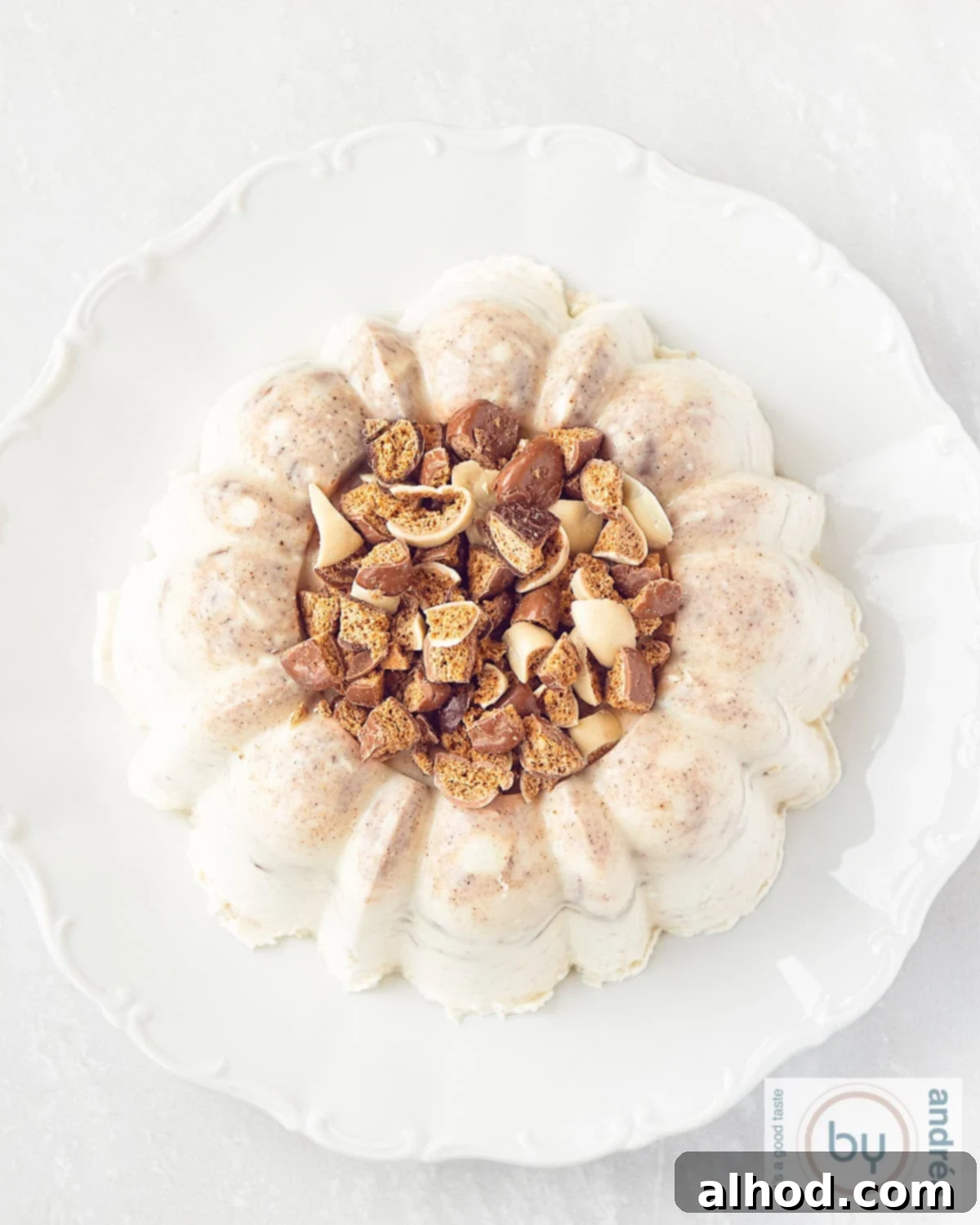 A photo of a chocolate pepernoten pudding from above, showing its creamy texture and crunchy cookie pieces.