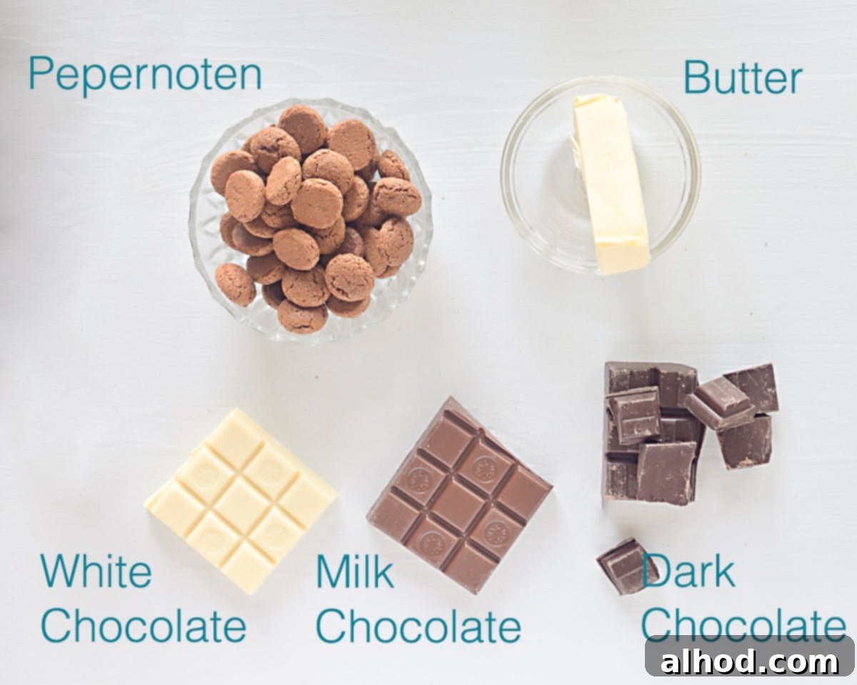 Pepernoten Chocolate Discs 3 A simple array of ingredients for Pepernoten flikken (Dutch Pepernoten Chocolates): chopped chocolate, butter, and pepernoten.