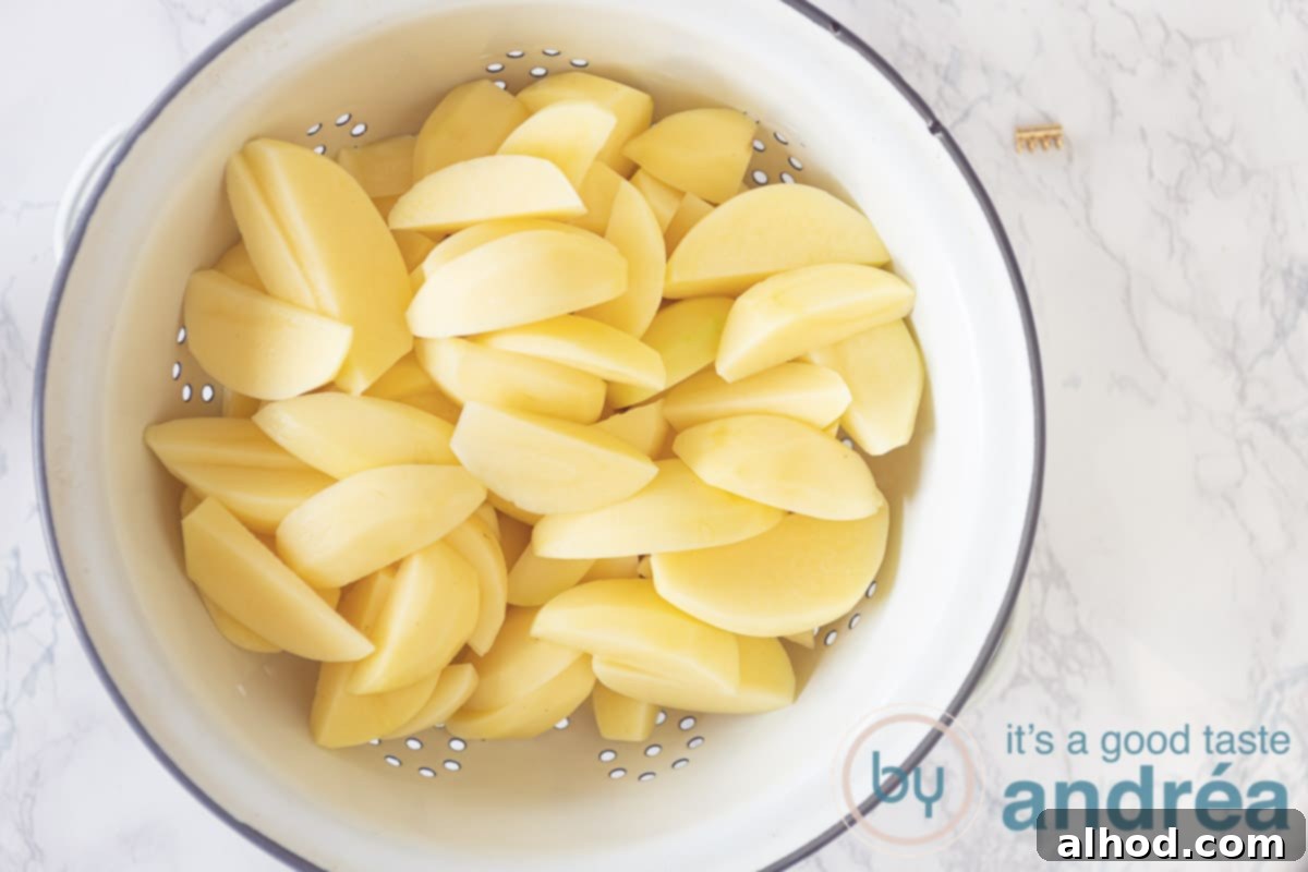 Golden Garlic Thyme Roasted Potatoes 5 a colander with potato wedges