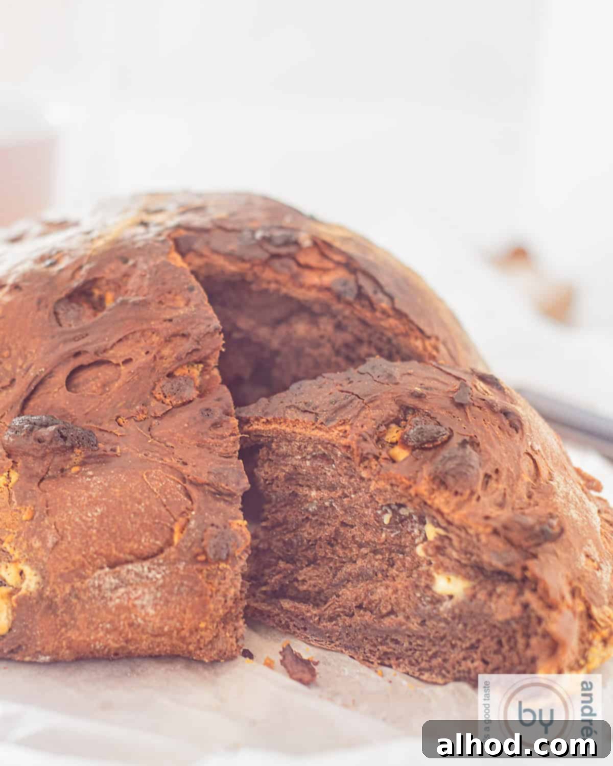 A height picture of chocolate bread with white chocolate. A slice cut of.