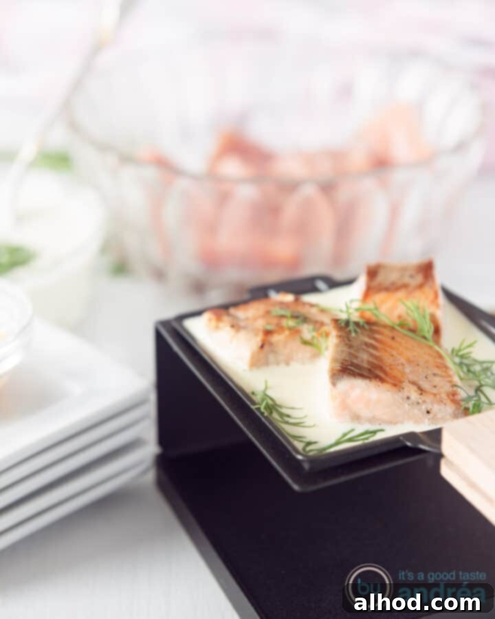 Grilled salmon with dill cream sauce and a slice of lime