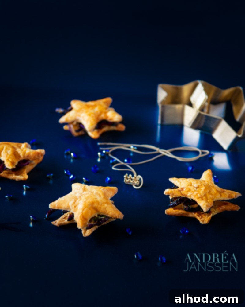 Unforgettable Yuletide Feast 4 An individual golden-brown onion tart garnished with fresh thyme leaves.