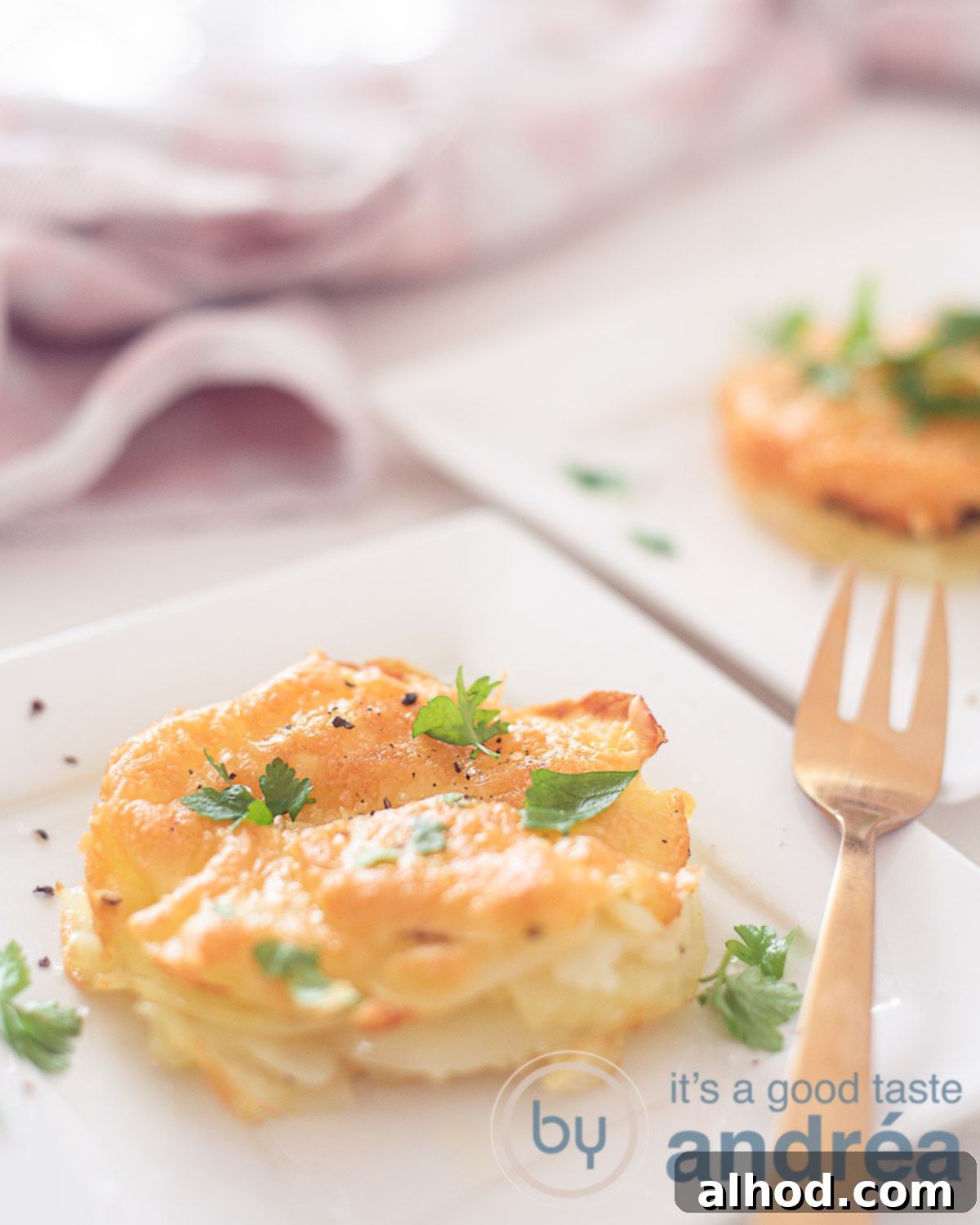 Unforgettable Yuletide Feast 7 Individual serving of a golden-brown potato gratin, appearing lighter and healthier.