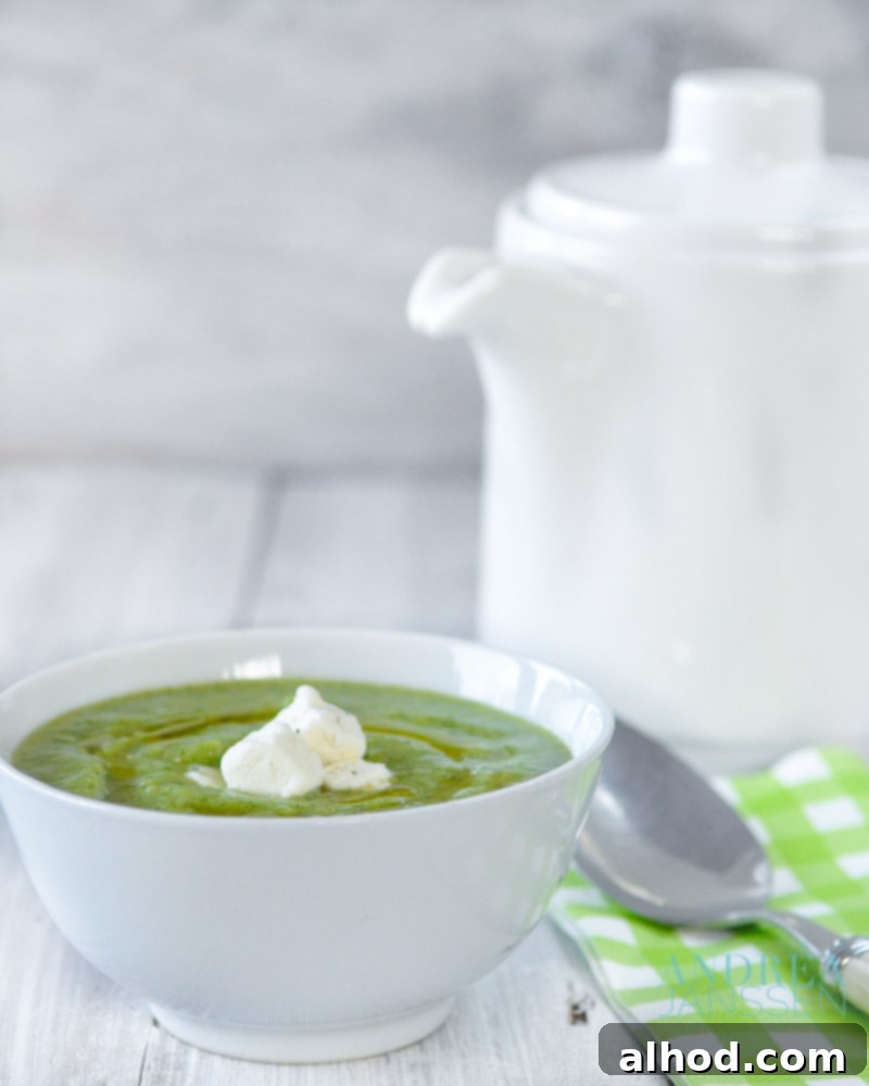 Broccoli soup in a white bowl and a tea pot
