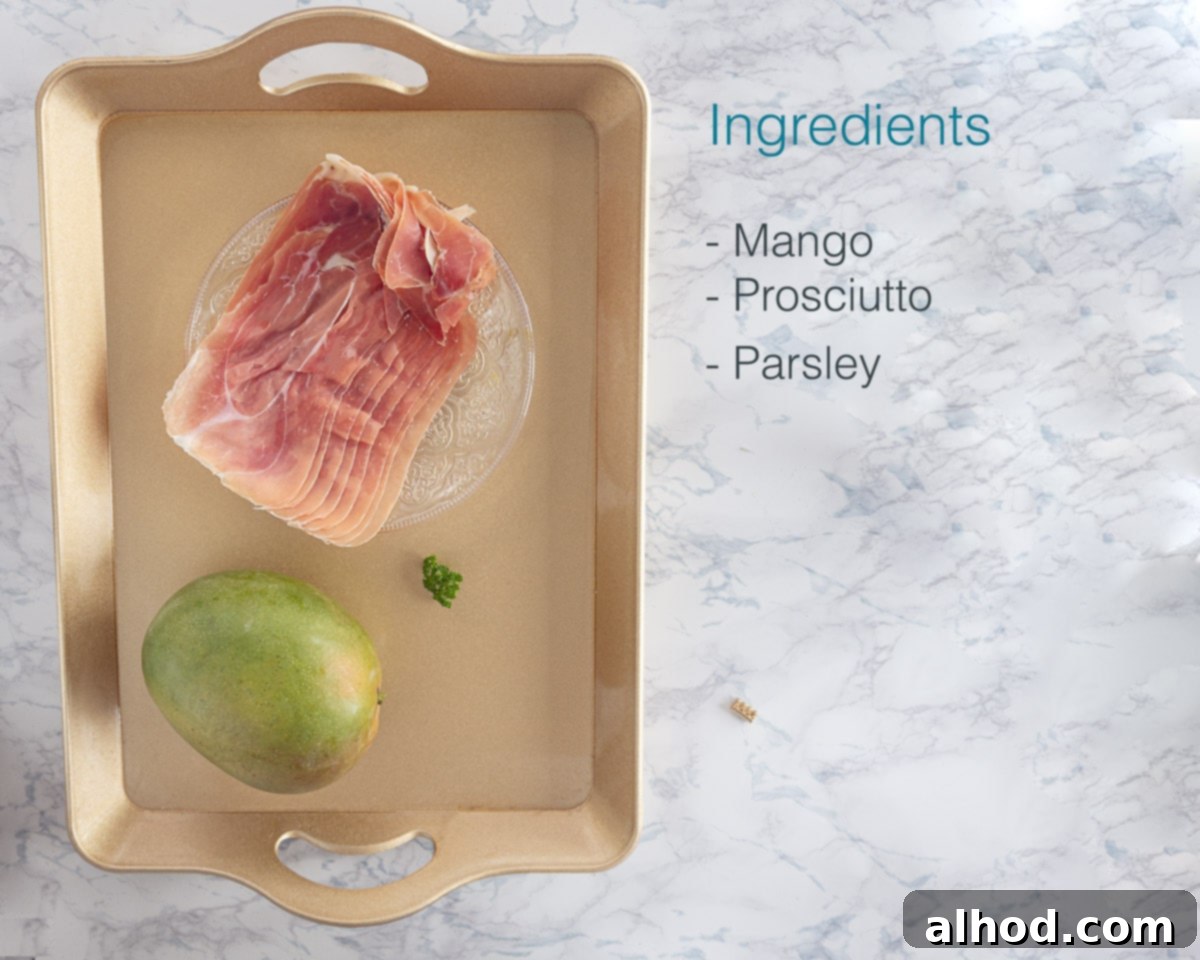 Ingredients for a Mango Prosciutto Appetizer on a marble background