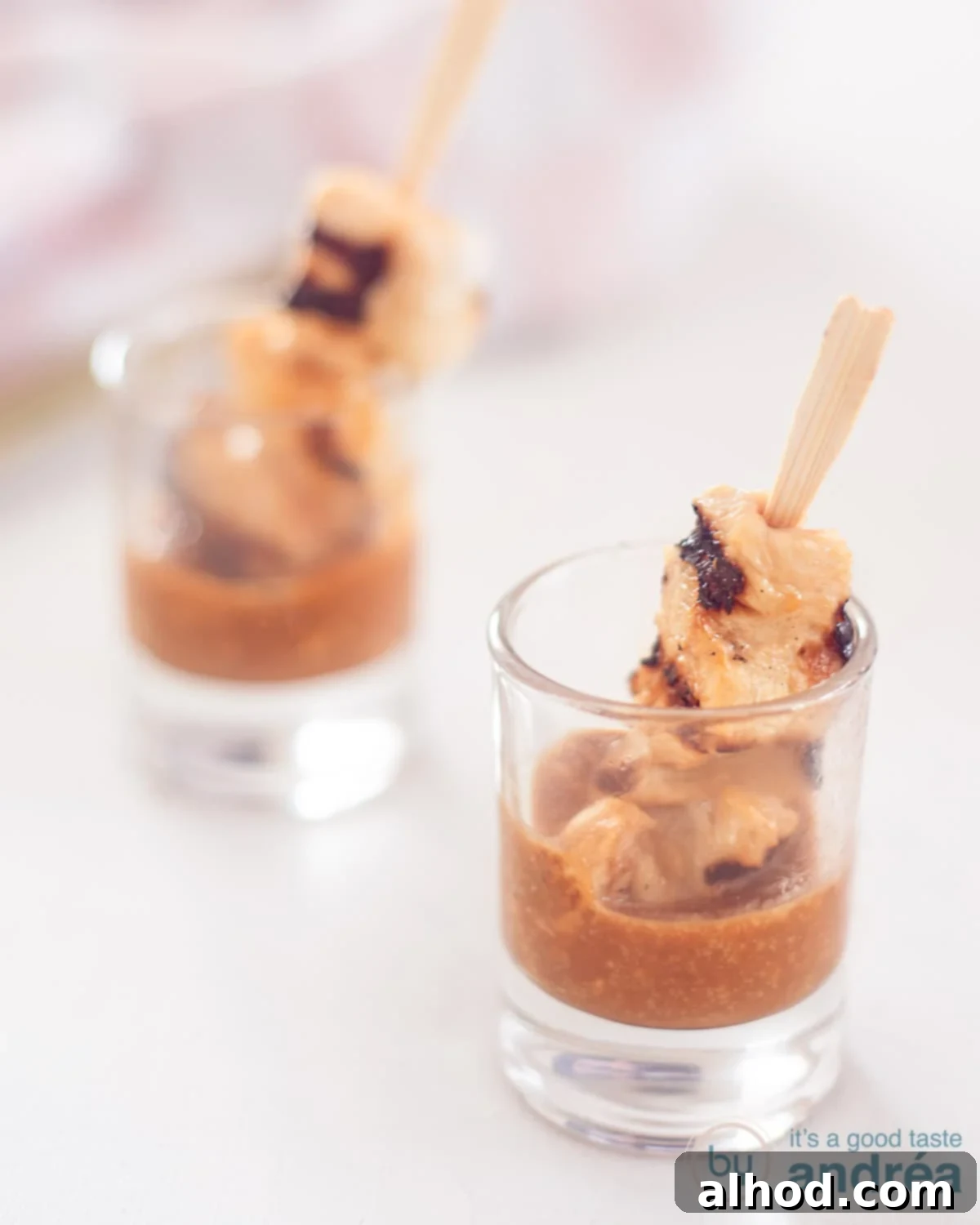 Chicken Satay with Creamy Cashew Sauce 3 Tender chicken satay skewers with creamy cashew nut sauce, an irresistible appetizer.