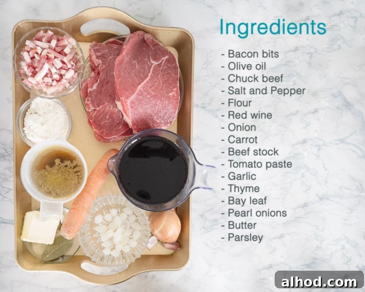 Slow Cooker Beef Bourguignon Without Mushrooms 3 A golden tray displaying the fresh ingredients for Slow Cooker Beef Bourguignon without mushrooms, accompanied by a text list detailing each component.